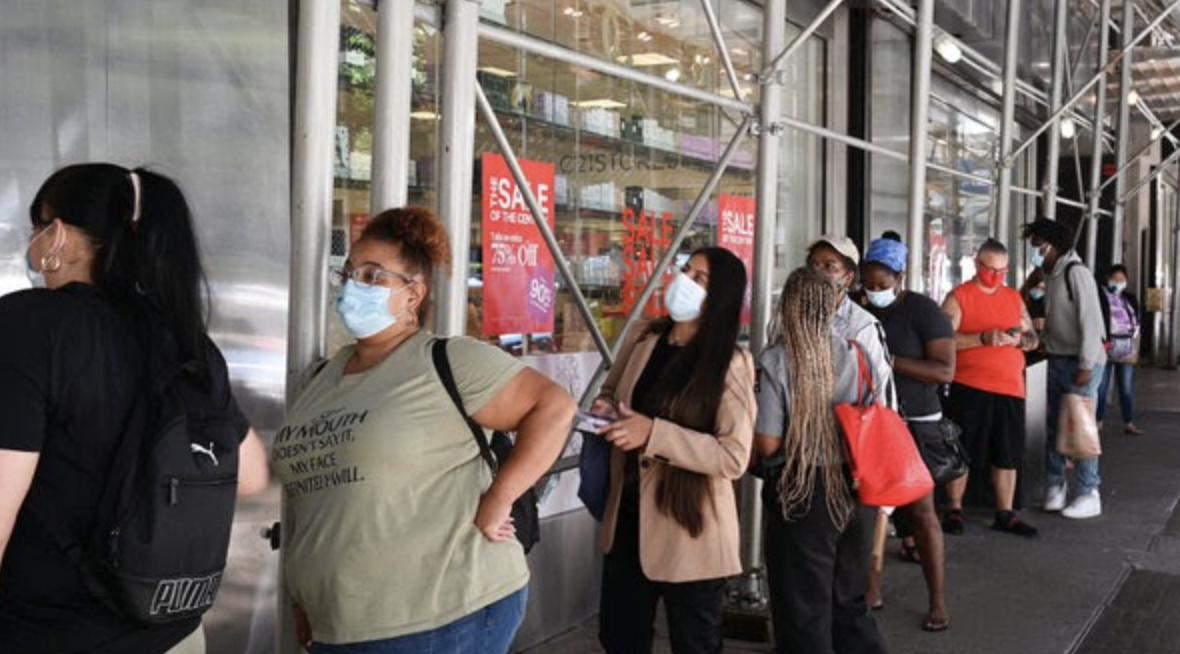 Cannabis shoppers wait in line during COVID