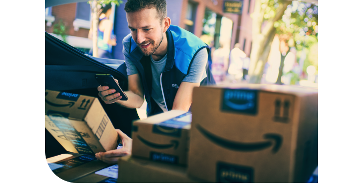 Amazon Flex driver loading packages into a car